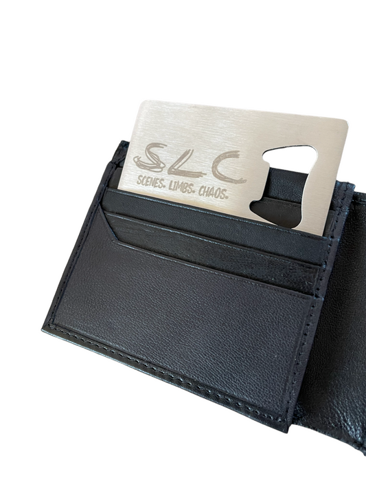 Silver credit card sized bottle opener in a black wallet